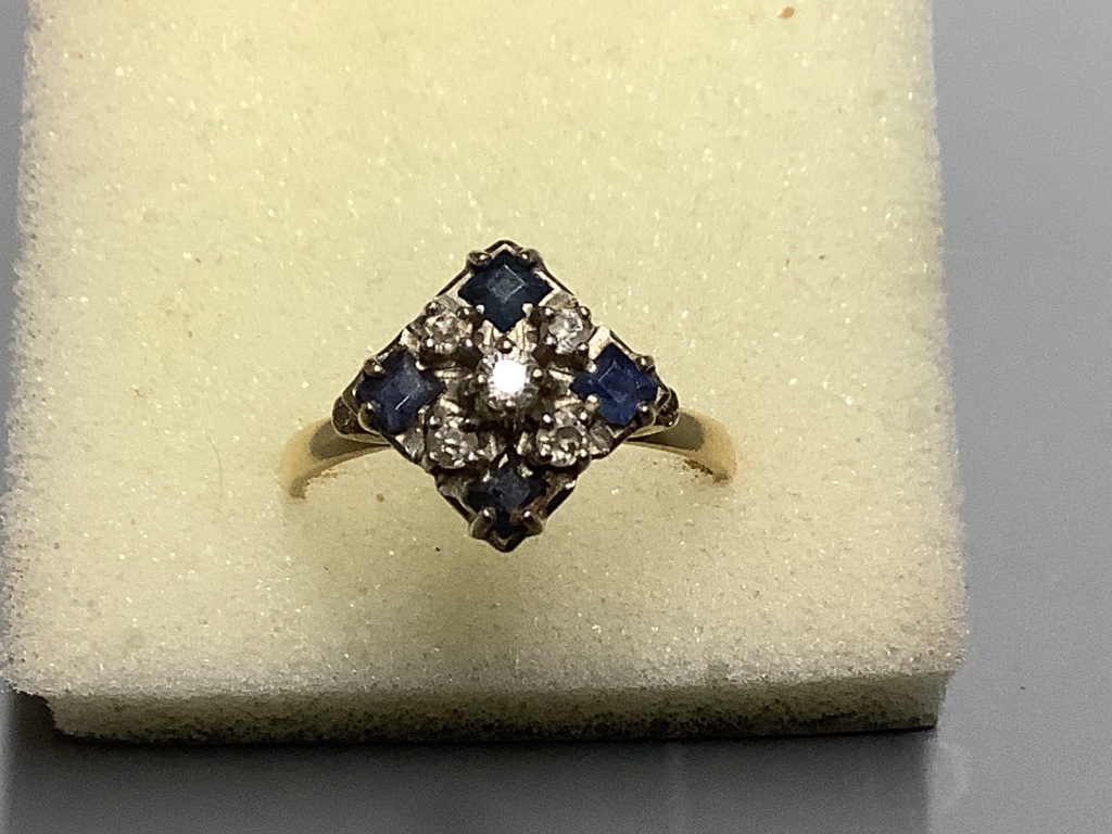 An 18ct, sapphire and diamond cluster ring, size N, gross 3.1 g.